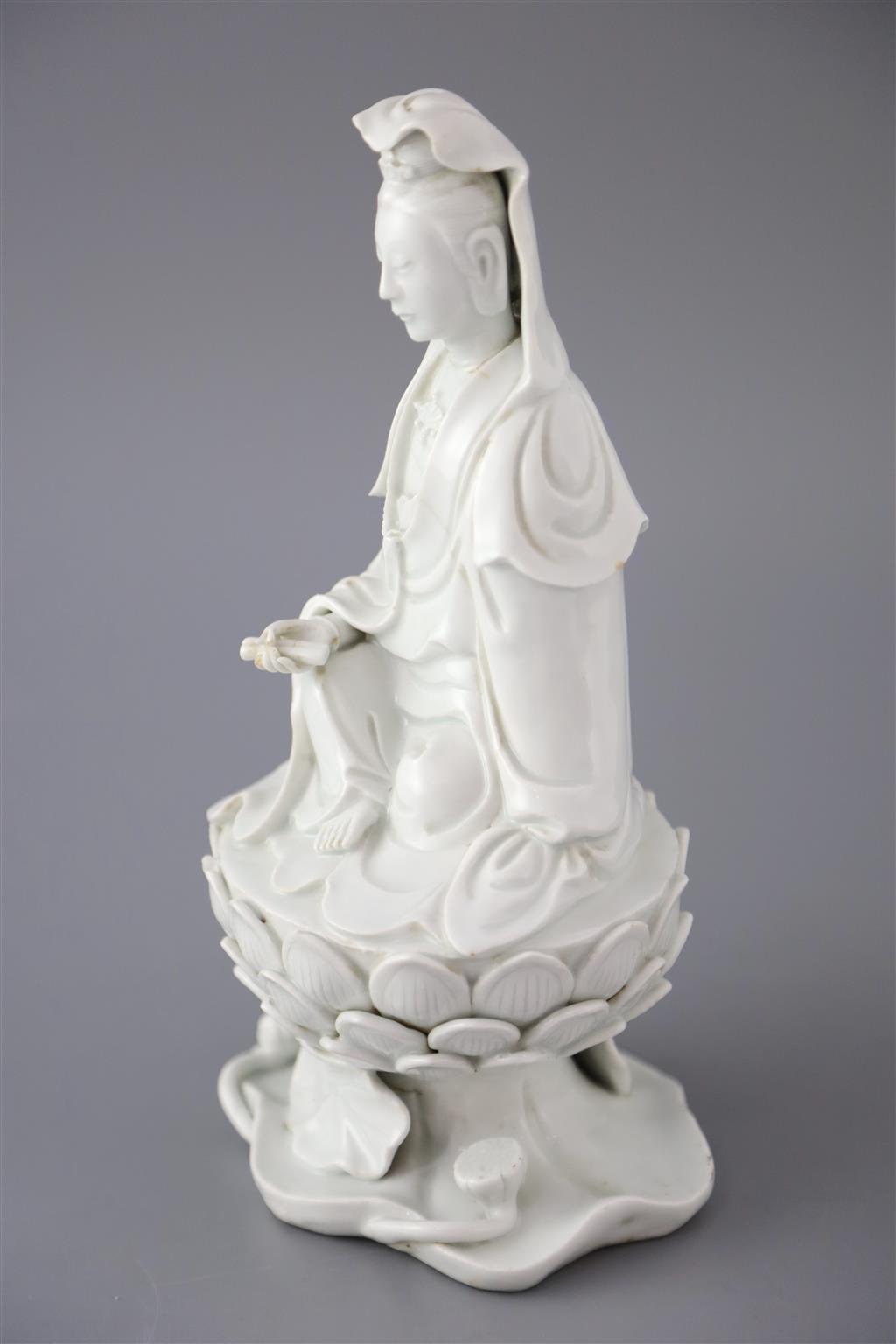 A Chinese Dehua blanc de chine seated figure of Guanyin, 18th/19th century, 25cm high